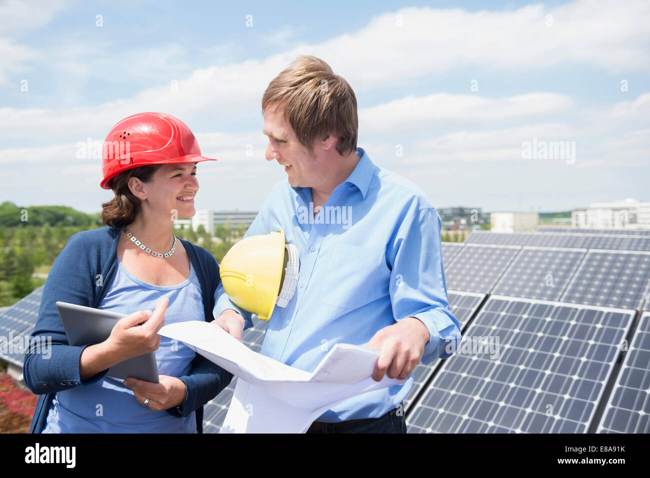 Female architect meeting client solar energy panel Stock Photo - Alamy