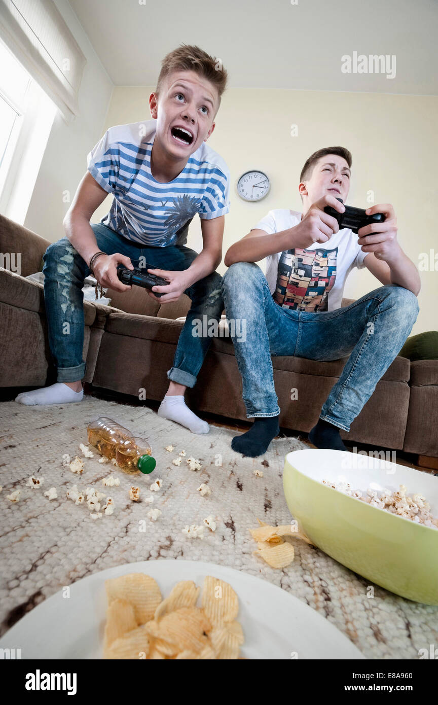 Two teenage boys playing video game Stock Photo