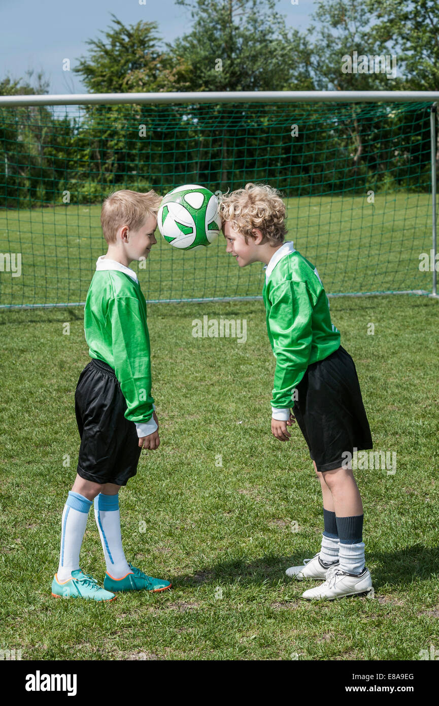 Two young soccer players learning ball control Stock Photo