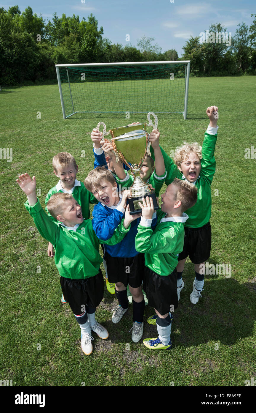 Young boys soccer team holding trophy Stock Photo