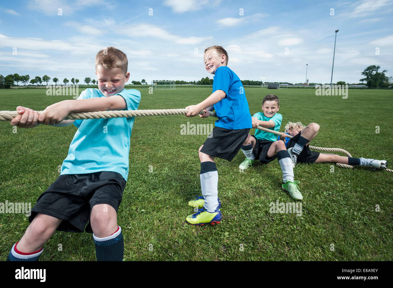 Young soccer team practicing Tug-of-war strength Stock Photo