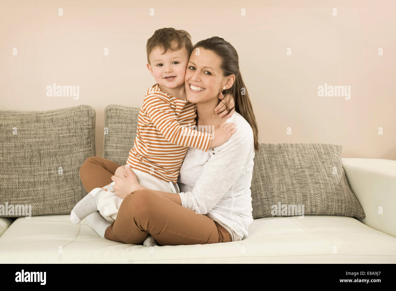 Kid sitting on mom lap hires stock photography and images  alamy