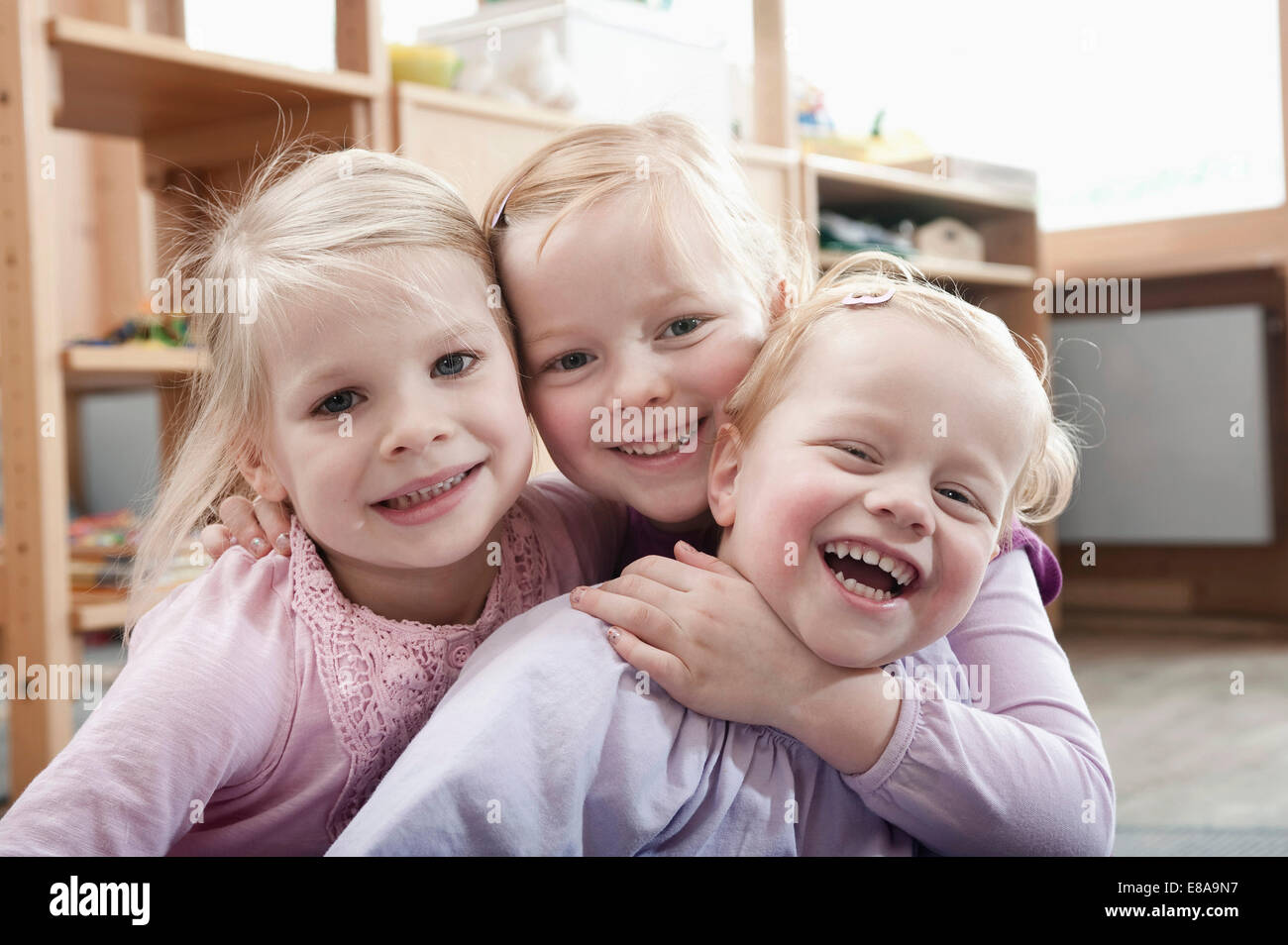 Three little girls, best friends, in kindergarten Stock Photo: 73985891