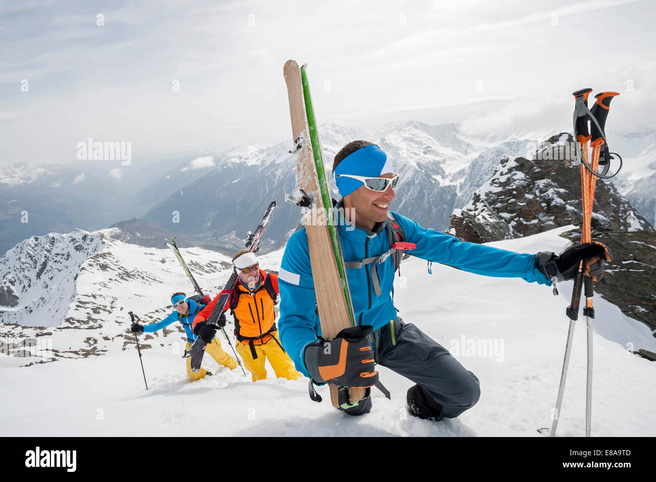 Climbing deep snow skiing mountains cross-county Stock Photo