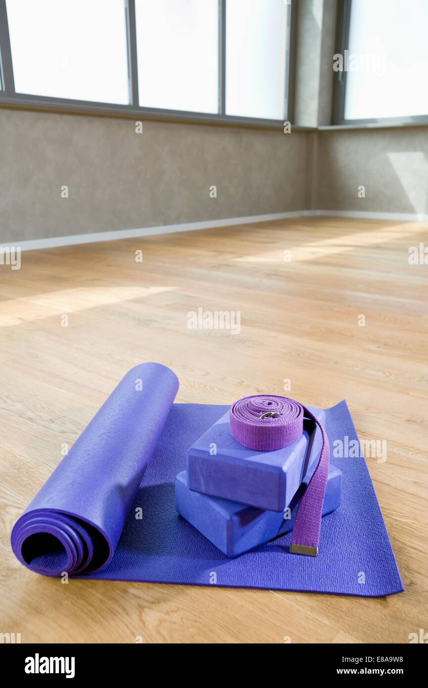Yoga matt belt still life yoga block floor Stock Photo Alamy
