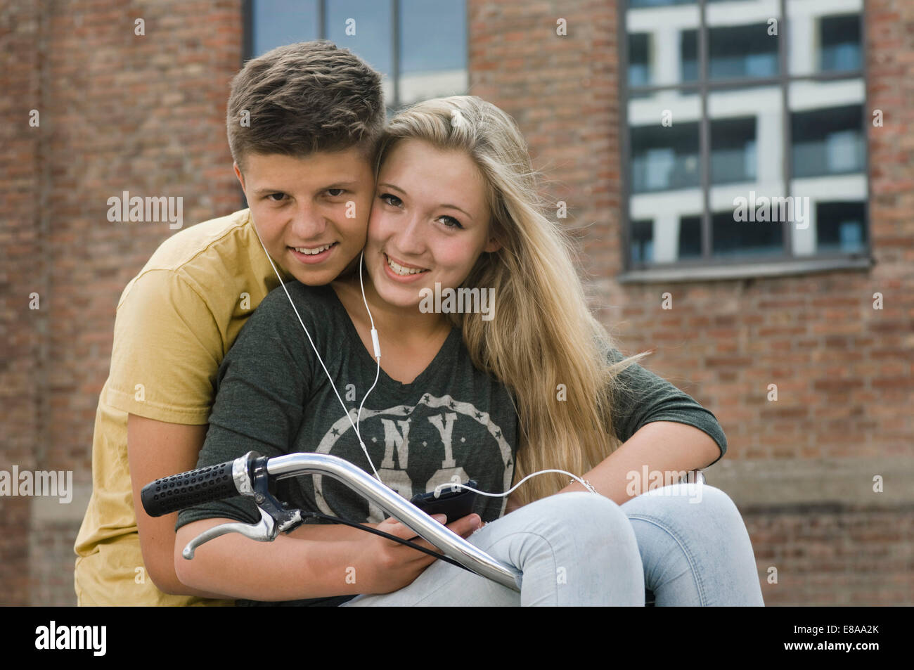 Portrait of teenage boy and teenage girls smiling Stock Photo - Alamy