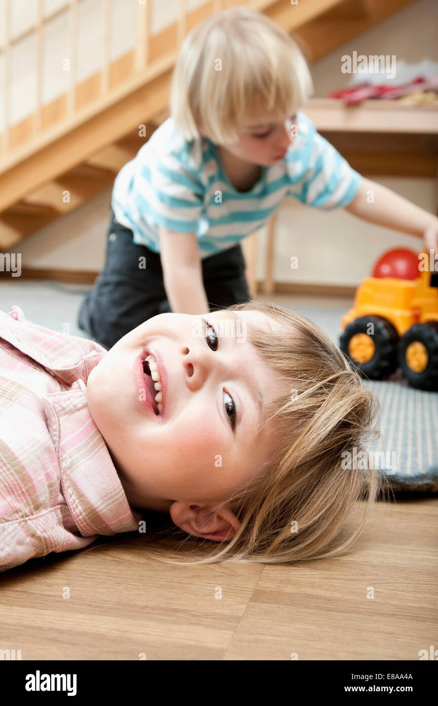 Little girl and little boy playing in kindergarten Stock Photo