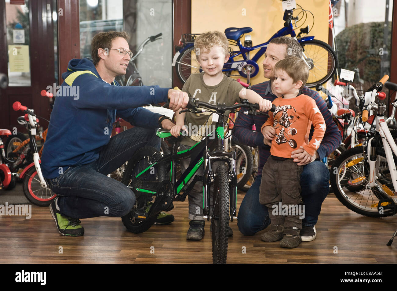 Boy getting a new children's bike Stock Photo Alamy
