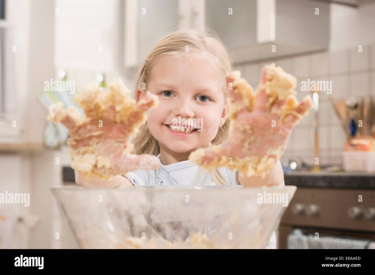 Girl hands covered with dough, smiling, portrait Stock Photo Alamy