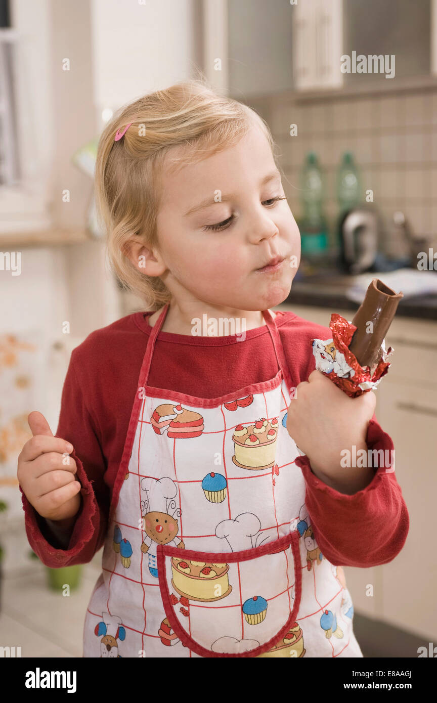 Girl eating chocolate Stock Photo Alamy