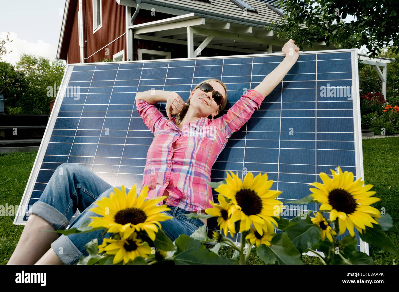 Solar panel young woman relaxing stretching Stock Photo Alamy