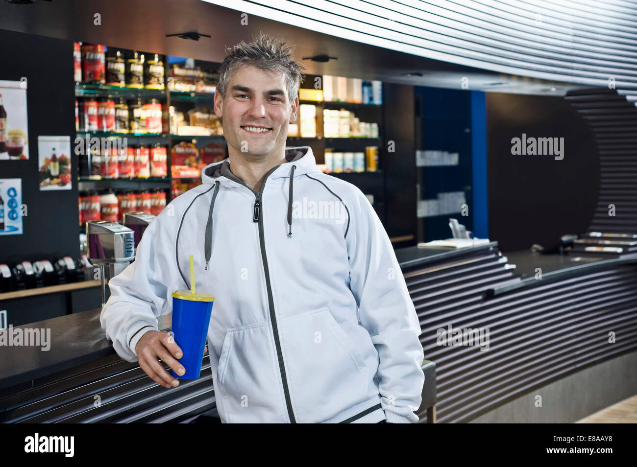 Smiling man at the bar of a gym Stock Photo