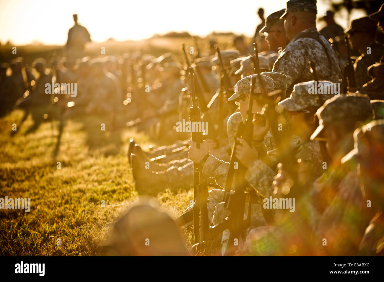 U.S. Soldiers listen during a rifle marksmanship class prior to the inaugural Army Reserve Small Arms Championship at Camp Robinson, Ark., Sept. 22, 2014. Approximately 70 Soldiers, comprising 14 teams, came from all over the country to compete. Stock Photo