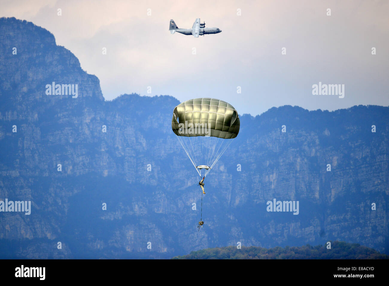 A U.S. Army paratrooper assigned to the 173rd Brigade Support Battalion, 173rd Airborne Brigade Combat Team lands after a jump at Juliet Drop Zone in Pordenone, Italy, Sept. 24, 2014. U.S. Soldiers conducted an airborne operation with T-11 parachutes from Stock Photo