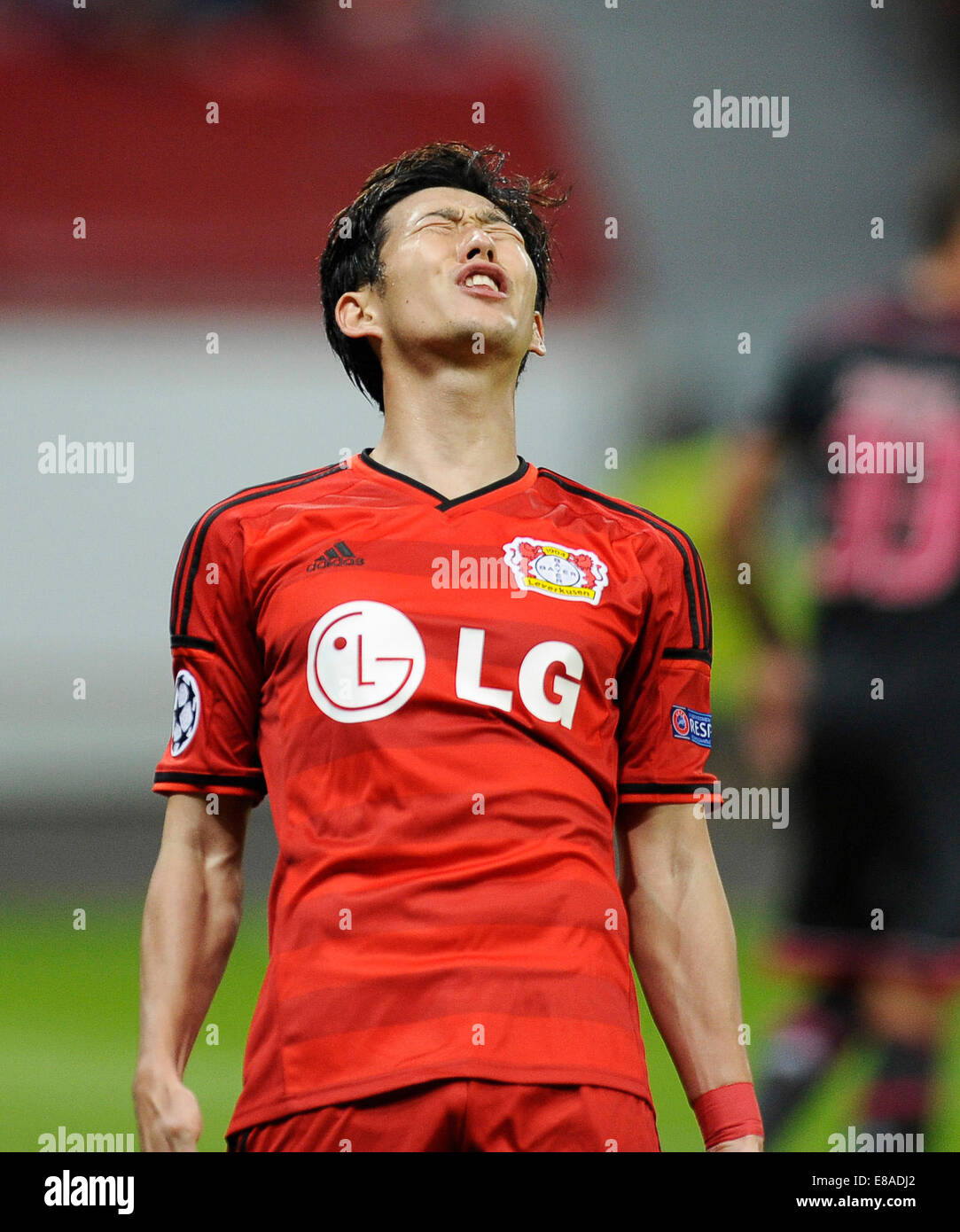 Leverkusen, Germany, 1st October, 2014. UEFA Champions League 2014/2015  Group stage Group C matchday 2, Bayer 04 Leverkusen (red) - Benfica  Lissabon (black) --- Heung-Min Son (Leverkusen) and Stefan Kie§ling  (Kiessling) (Leverkusen)