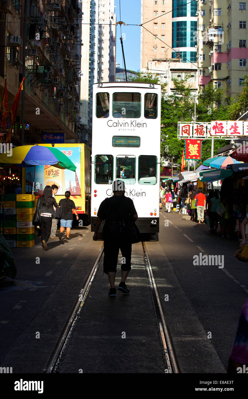 Vintage Tram Making Slow Progress. Chun Yeung Street, Hong Kong. Stock Photo