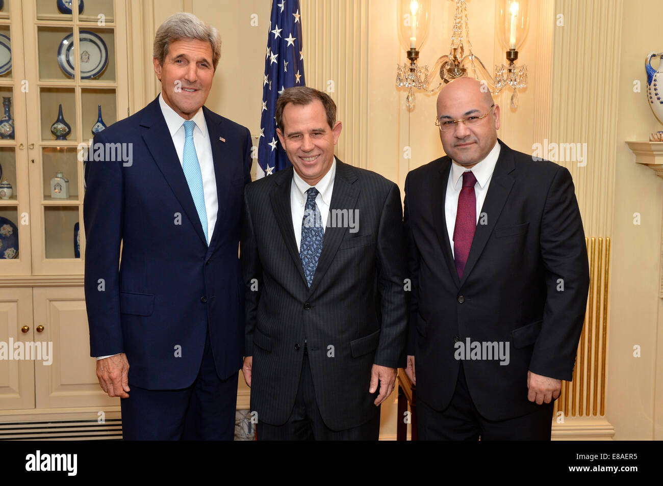 U.S. Secretary of State John Kerry, U.S. Ambassador-designate to Iraq Stuart Jones, and Iraqi Ambassador to the United States Lukman Faily at the swearing-in ceremony for Ambassador Jones at the U.S. Department of State in Washington, D.C., on September 1 Stock Photo