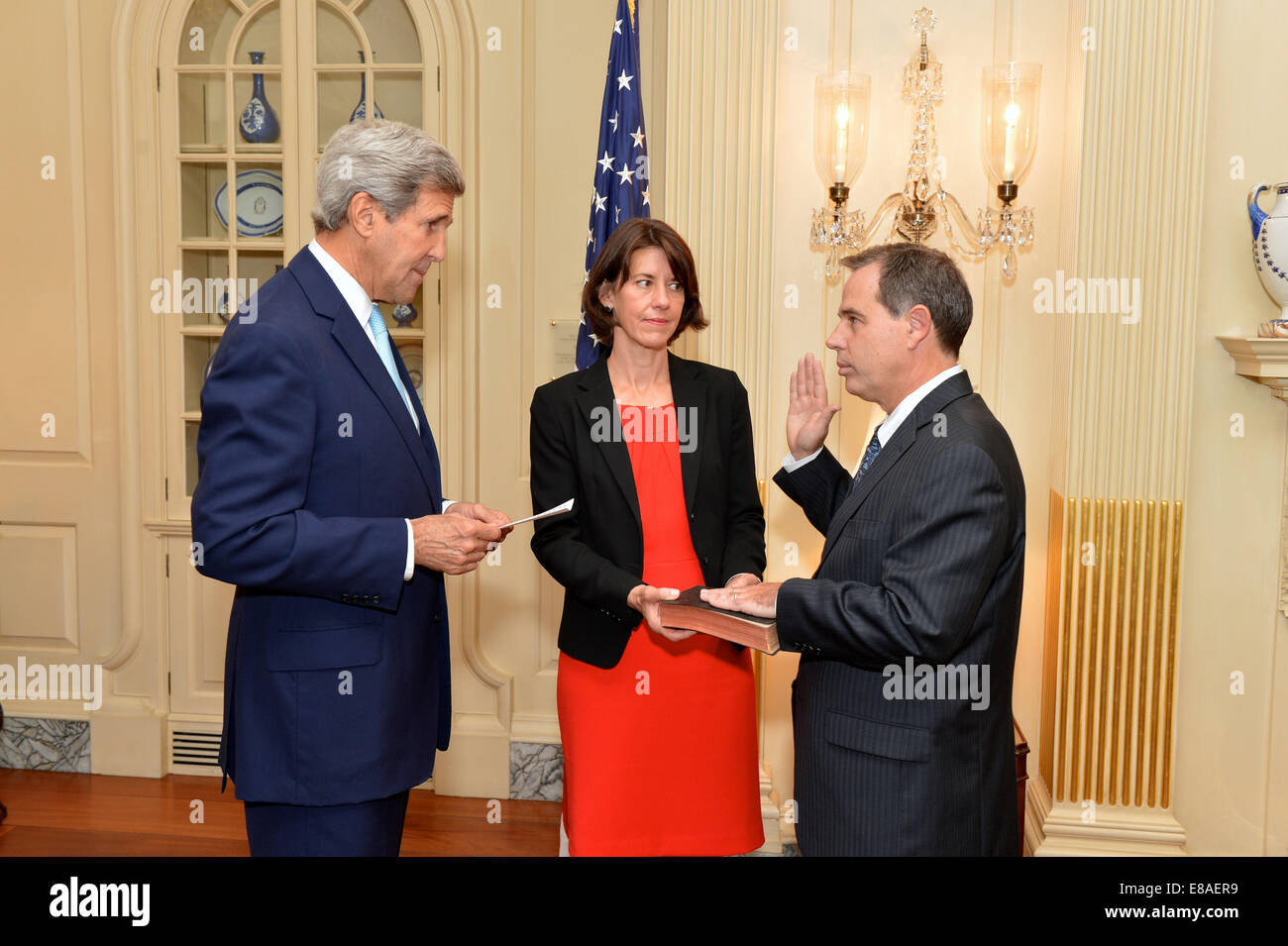 U.S. Secretary of State John Kerry swears in Stuart Jones as the U.S. Ambassador to Iraq at a ceremony at the U.S. Department of State in Washington, D.C., on September 17, 2014. Stock Photo
