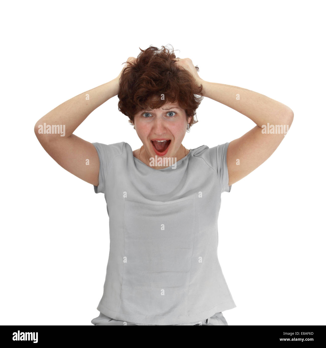Young woman with expression of horror on her face isolated on white background Stock Photo