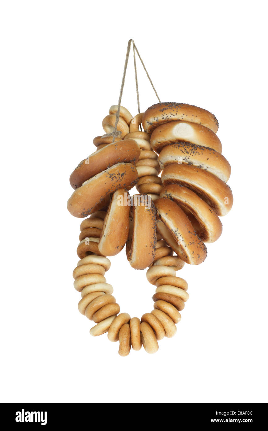 Bunch of bagels hangs on rope isolated on white background Stock Photo