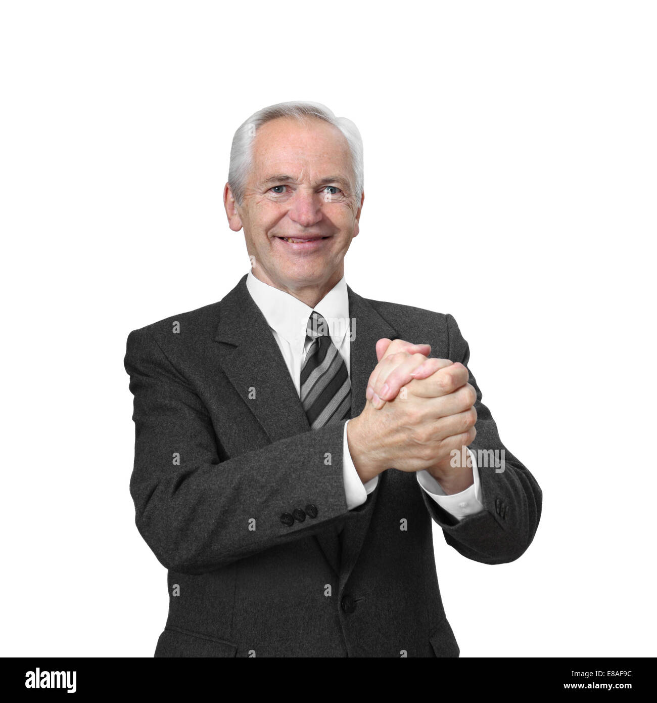 Senior man with smiling face holds his hands clasped in imitation of handshake isolated on white background Stock Photo