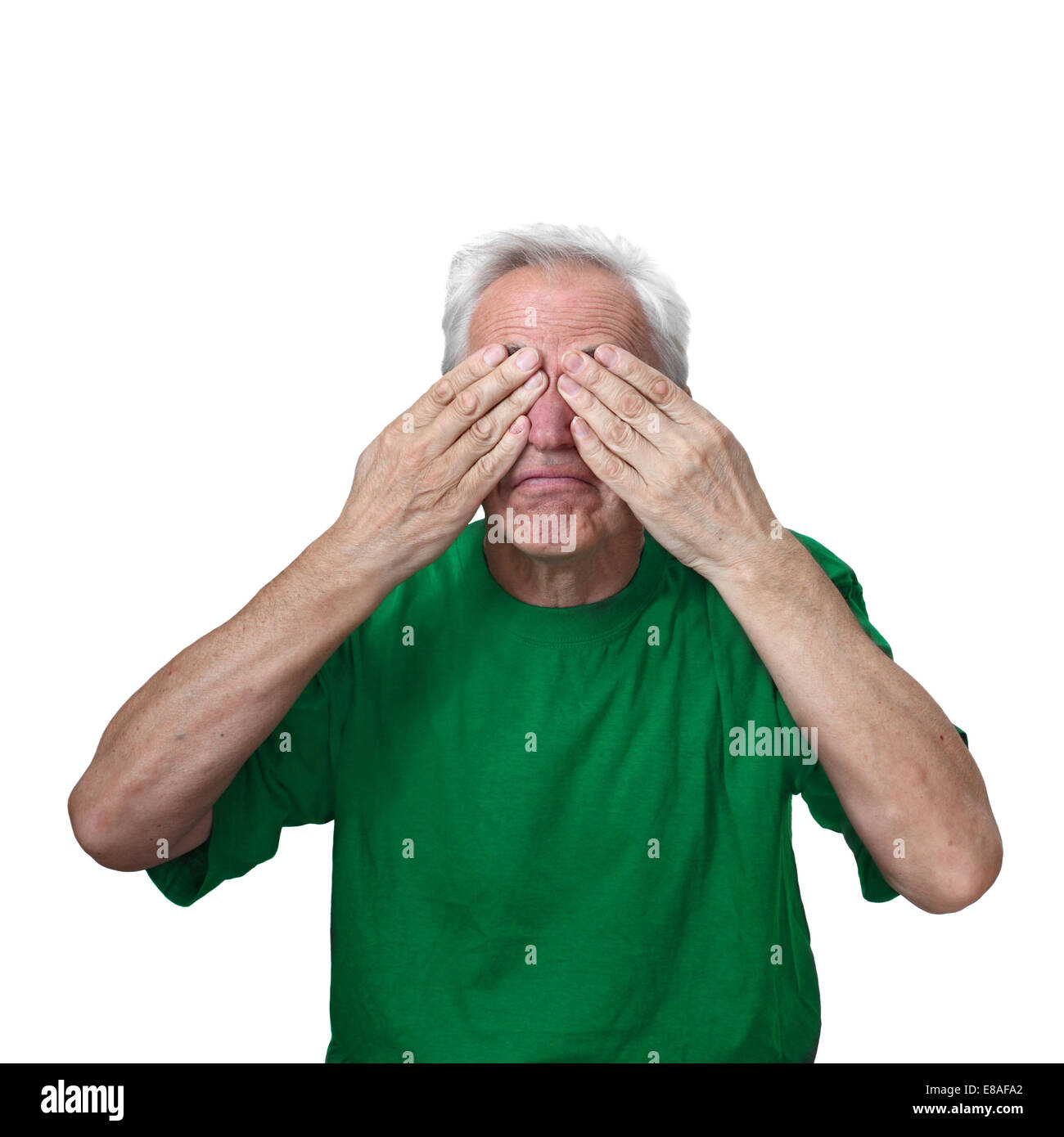 Senior man closed both his eyes with hands isolated on white background Stock Photo