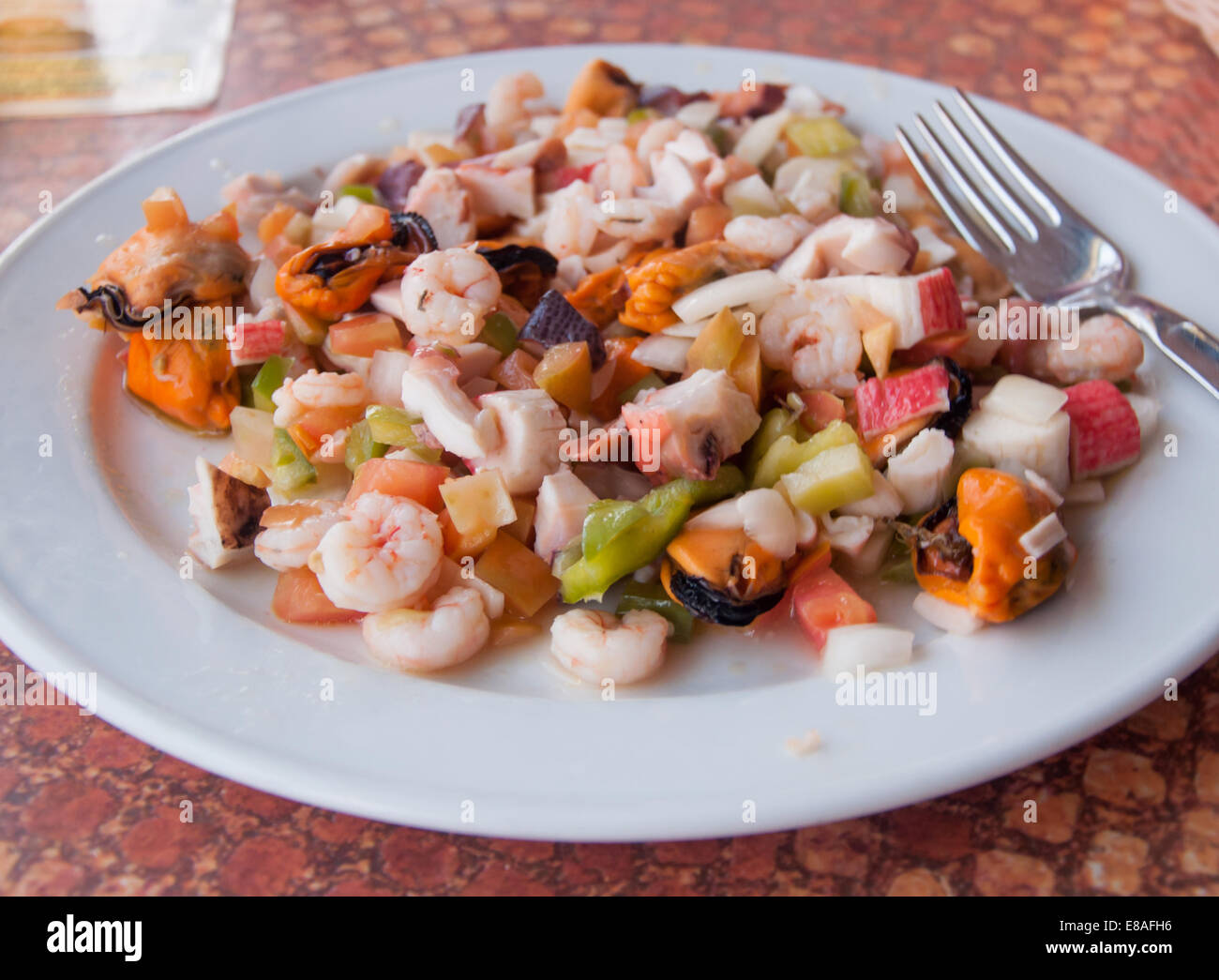 Plate with seafood such as pulpo, gambas, shrimp, mussels and vegetables. Spain. Stock Photo