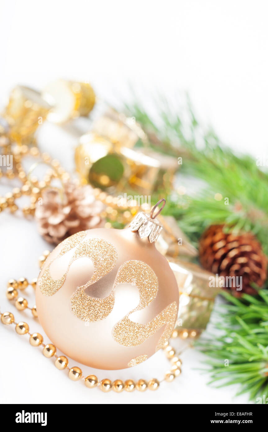 Golden Christmas decorations and green pine branch Stock Photo - Alamy
