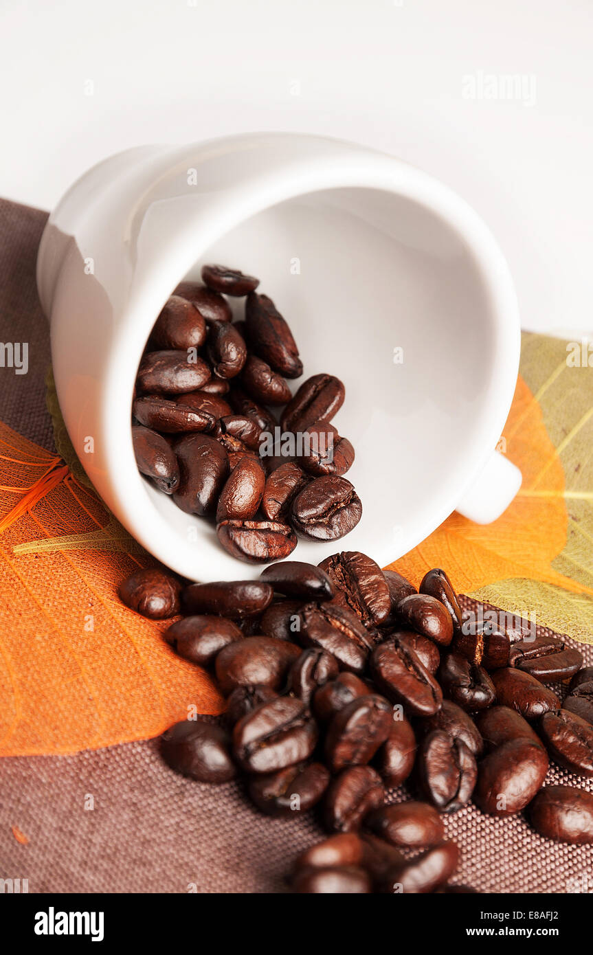 Background with coffee cup, autumn leaves and coffee beans Stock Photo ...