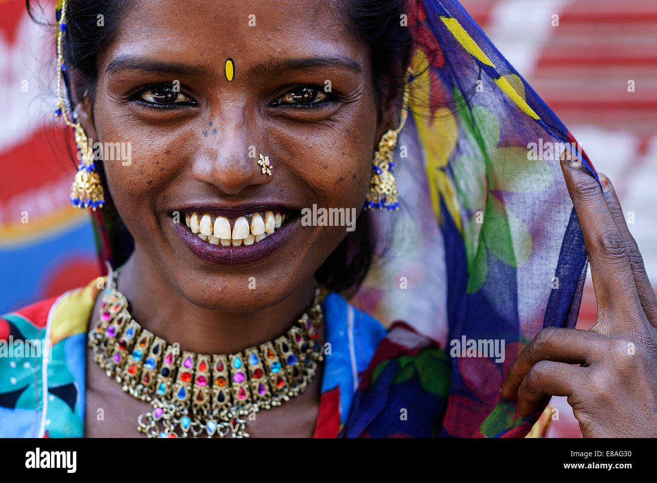 A portrait of a young smiling Indian beautiful woman wearing sari ...