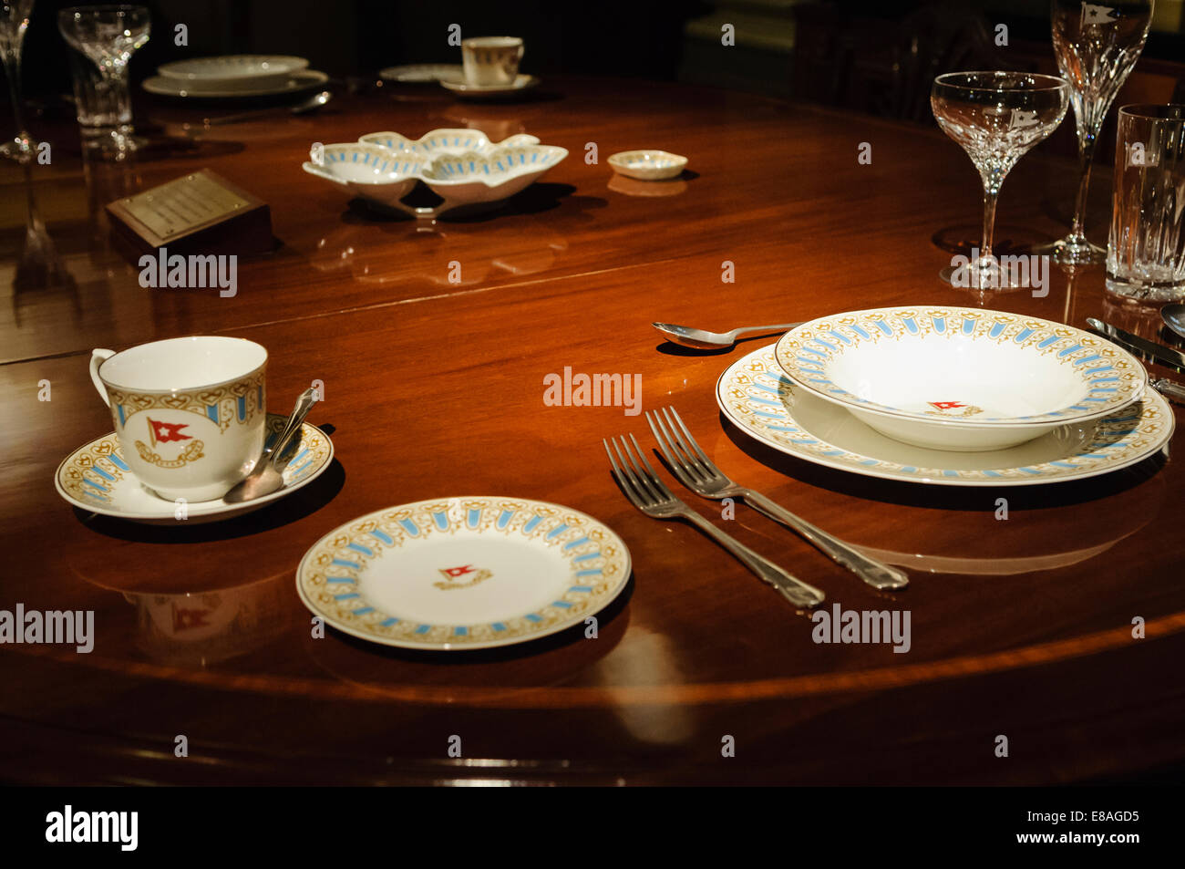 Dining table, cutlery & crockery which should have been in the Captain's private dining room on the Titanic when she sailed but were not ready in time Stock Photo