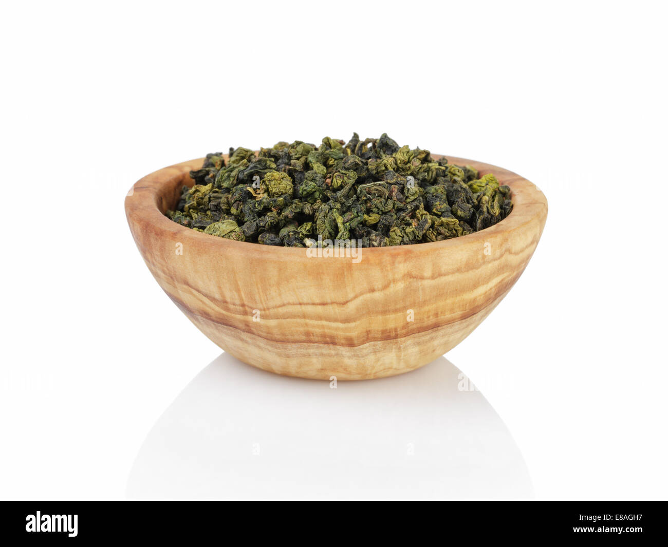 oolong green tea heap in bowl, isolated on white background Stock Photo