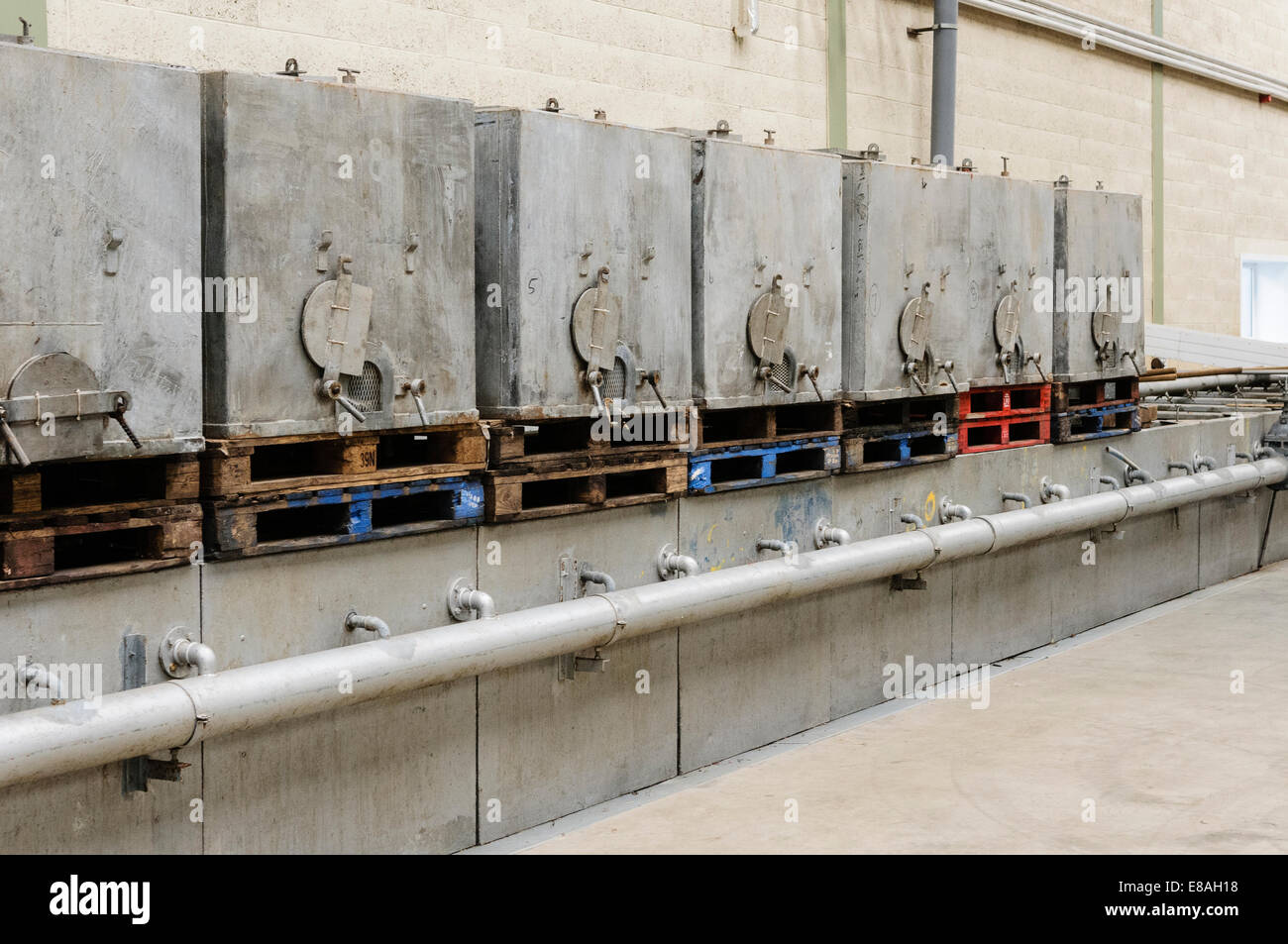 Galvanised tanks for storing and sorting eels. Stock Photo