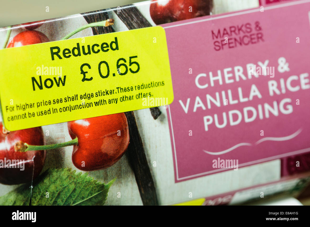 Reduced price label on a Marks and Spencer cherry and vanilla rice pudding Stock Photo
