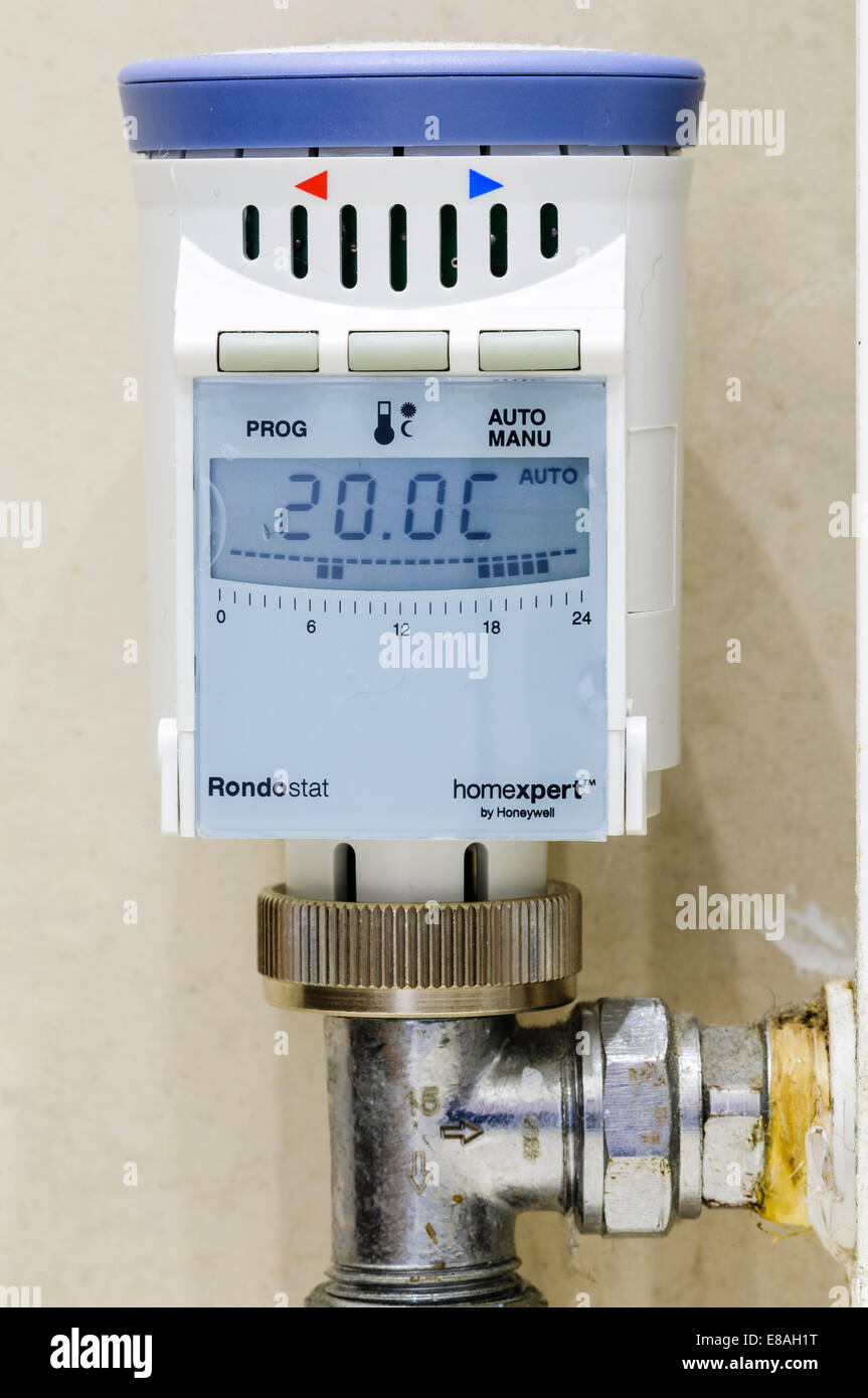 Programmable thermostatic radiator valve (TRV) set to 20C, allowing different temperatures to be selected at different times. Stock Photo