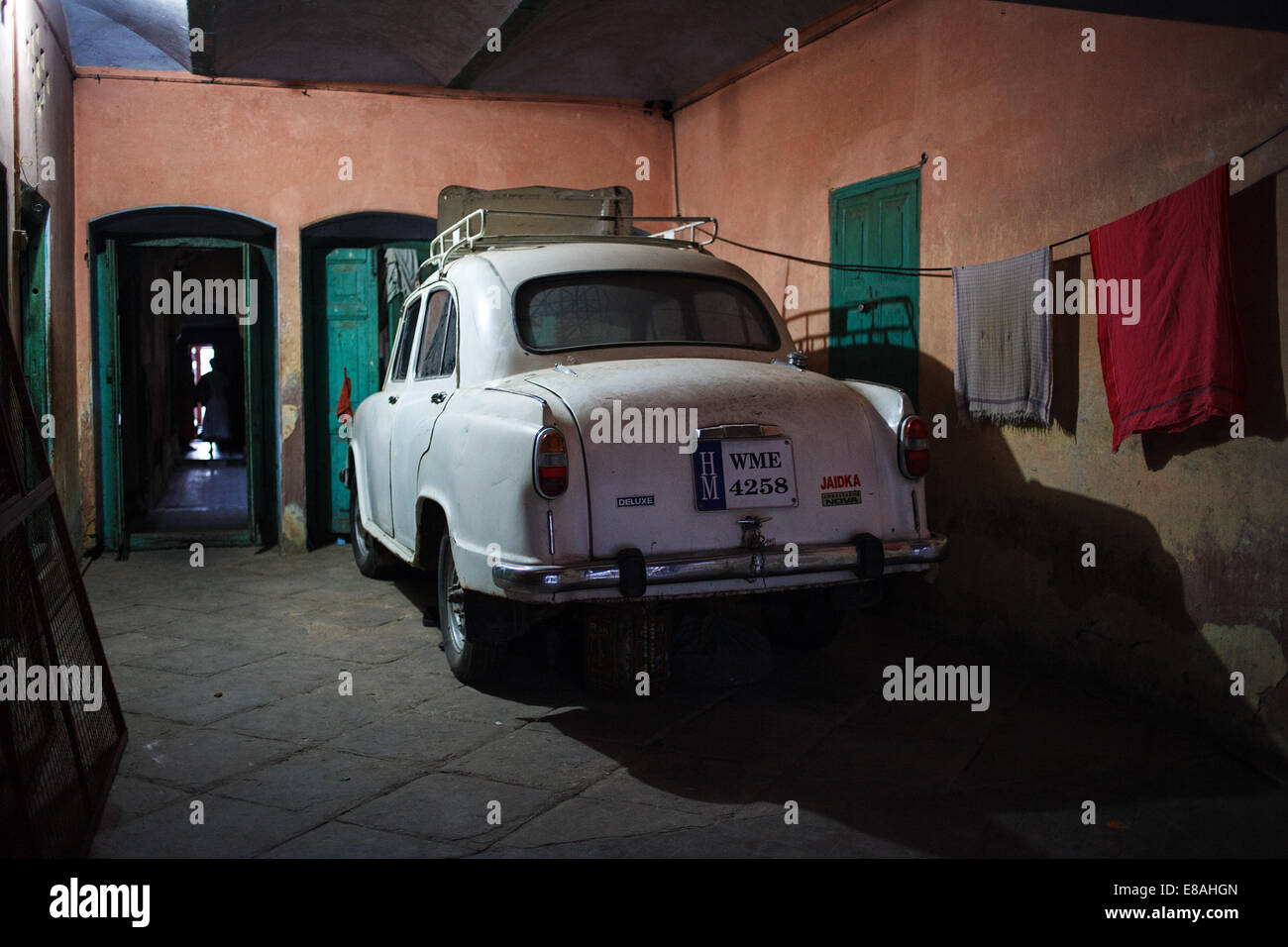 A classic Hindustan Ambassador car parked in a house yard in Varanasi, India. Stock Photo
