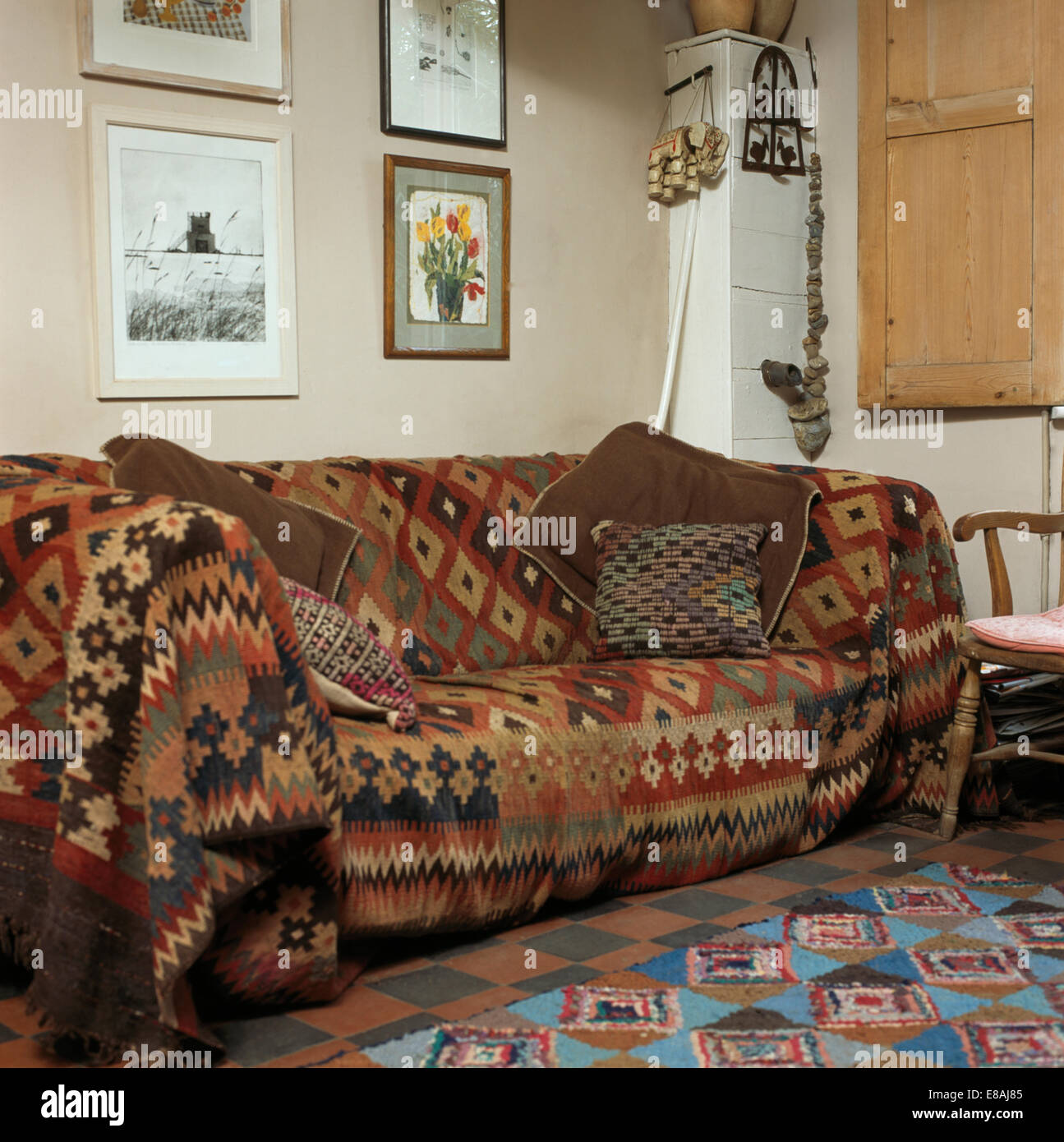Kelim rug used as a throw on sofa in country living room Stock Photo Alamy