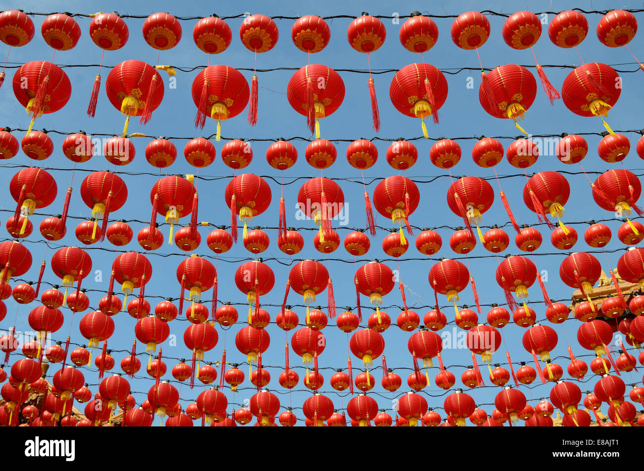 Groups of red lanterns hanging in rows above to celebrate Chinese new ...