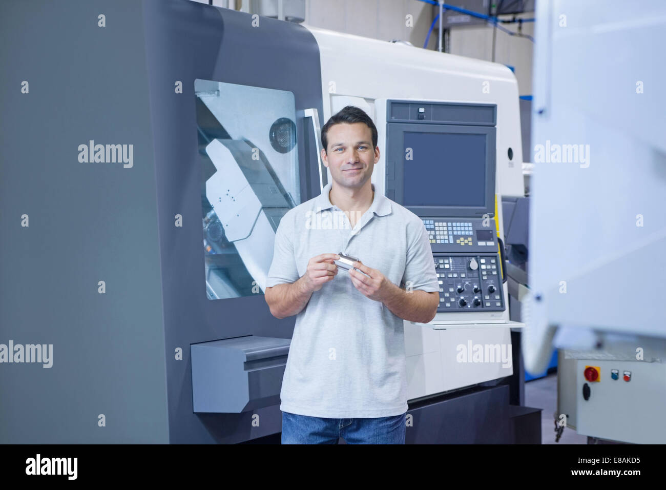 Engineer working in CNC precision engineering Stock Photo Alamy