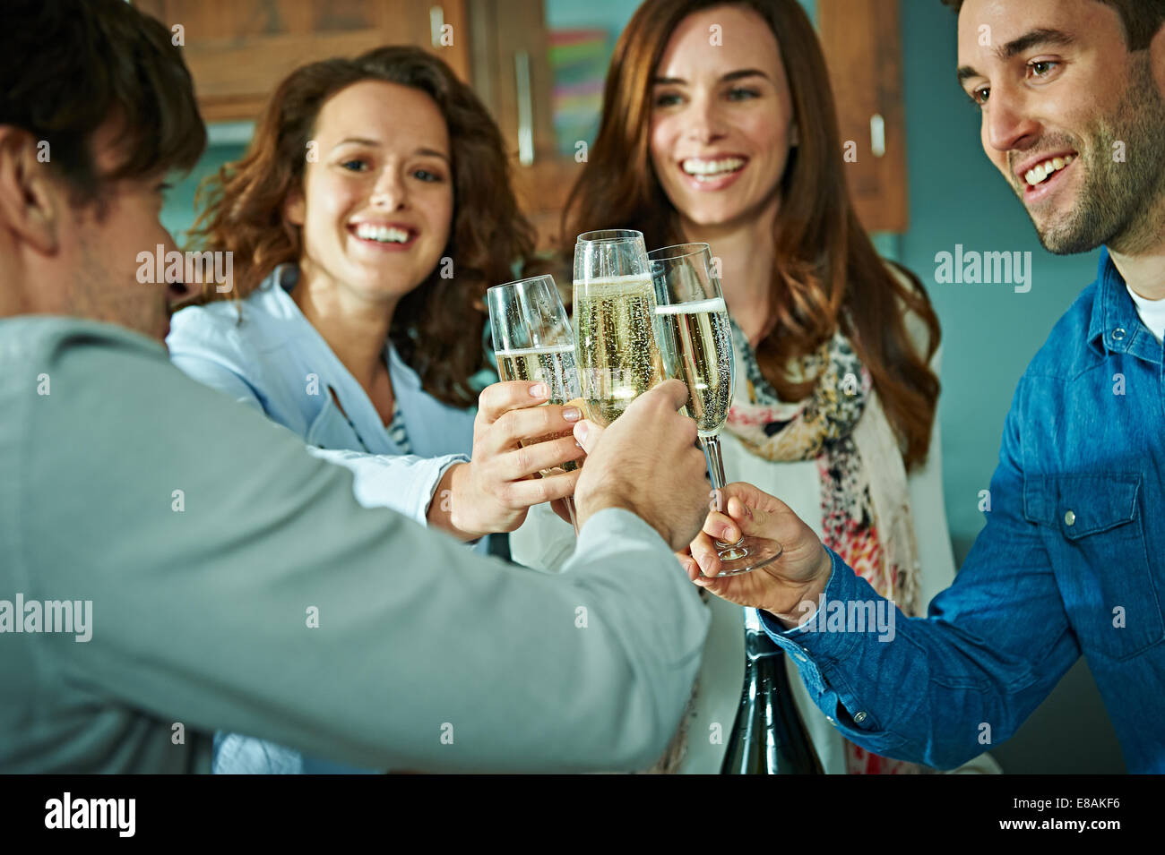 Friends celebrating at home Stock Photo