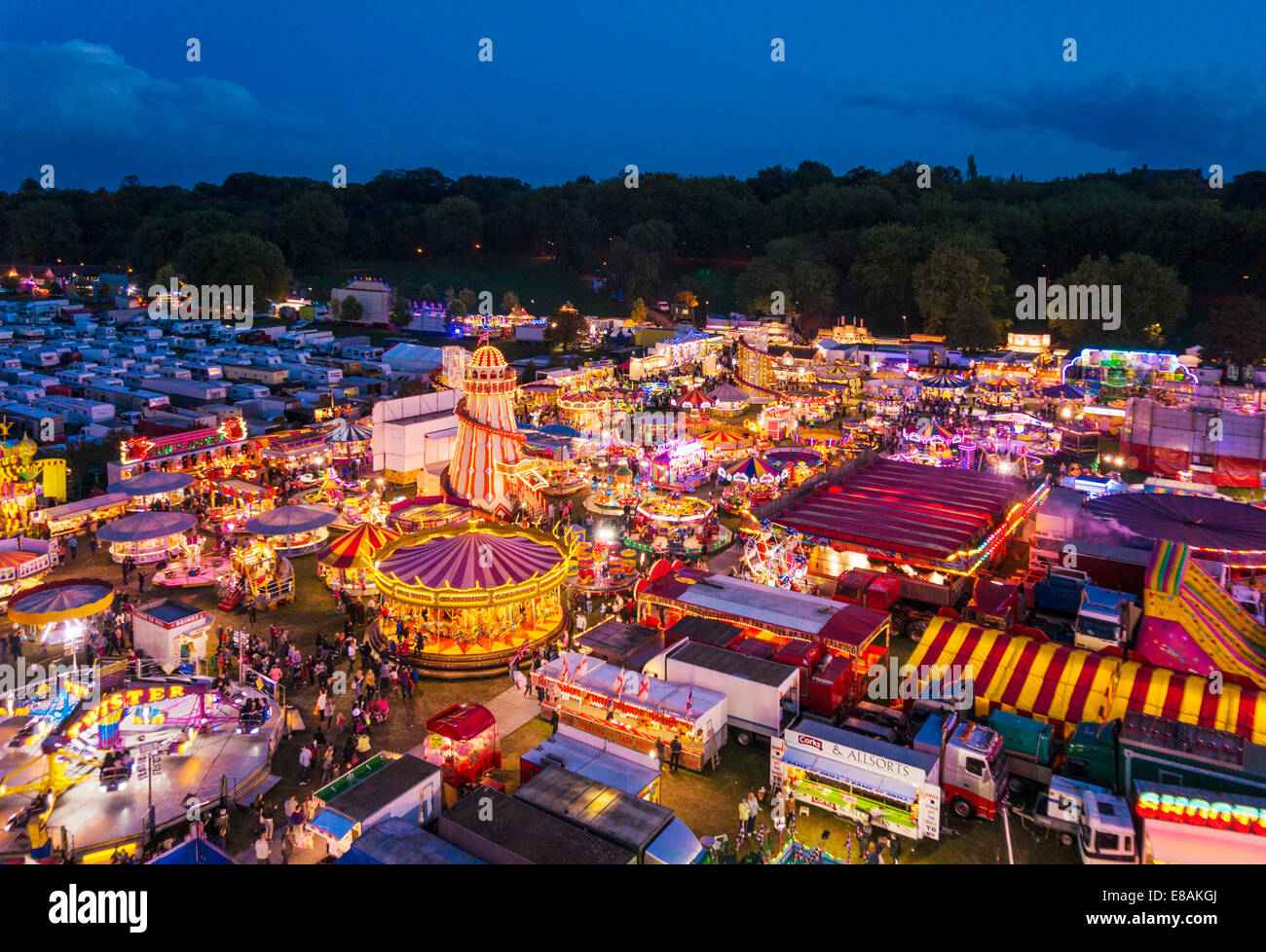 fairground rides at night at the Goose fair Nottingham East midlands Nottinghamshire gb uk eu europe Stock Photo