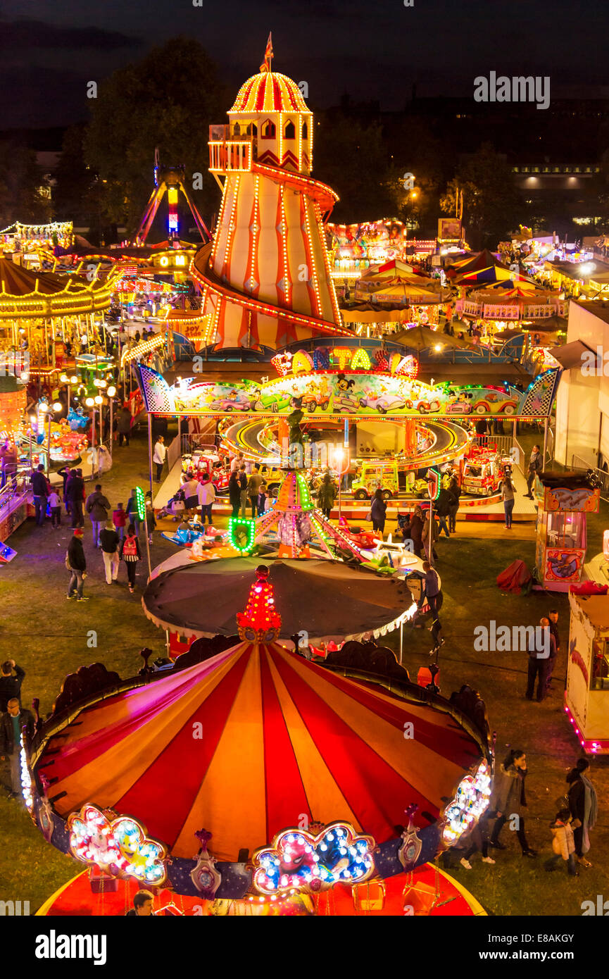 The helter skelter and fairground rides at night at the Goose fair Nottingham East midlands Nottinghamshire gb uk eu europe Stock Photo