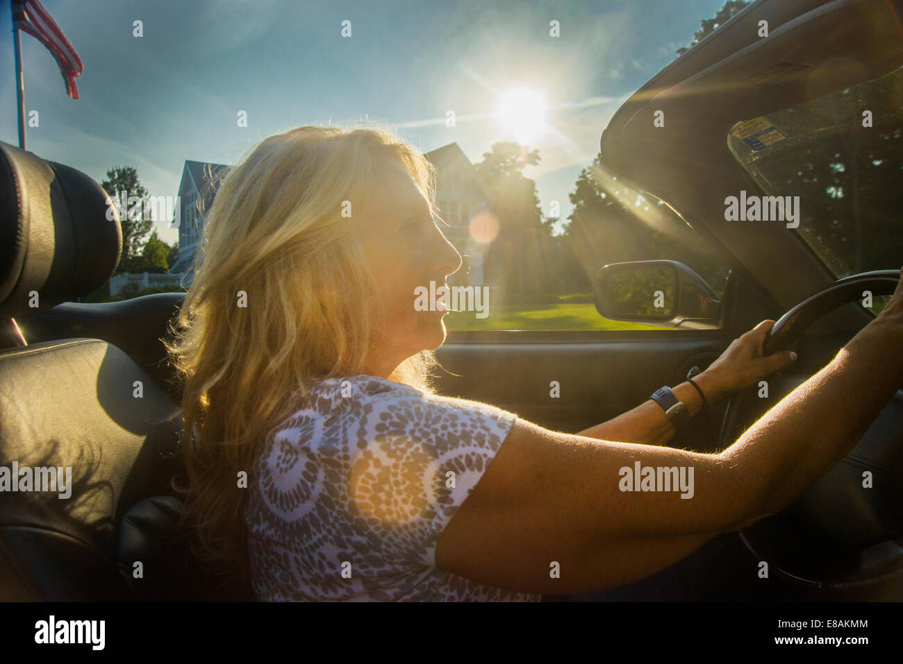 Mature woman driving convertible, Monmouth Beach, New Jersey, USA Stock Photo