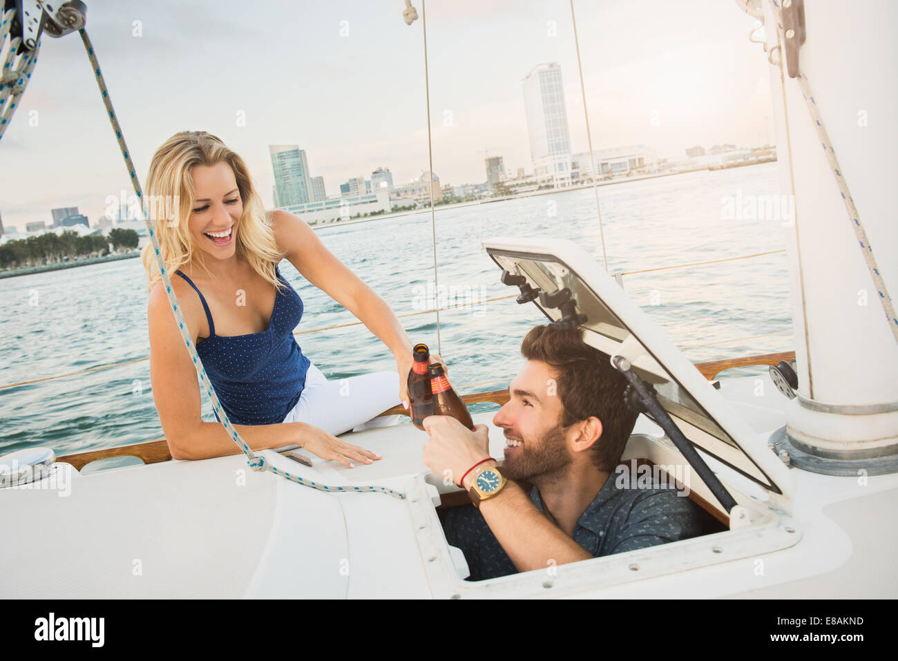 Couple on sailing boat with beer Stock Photo