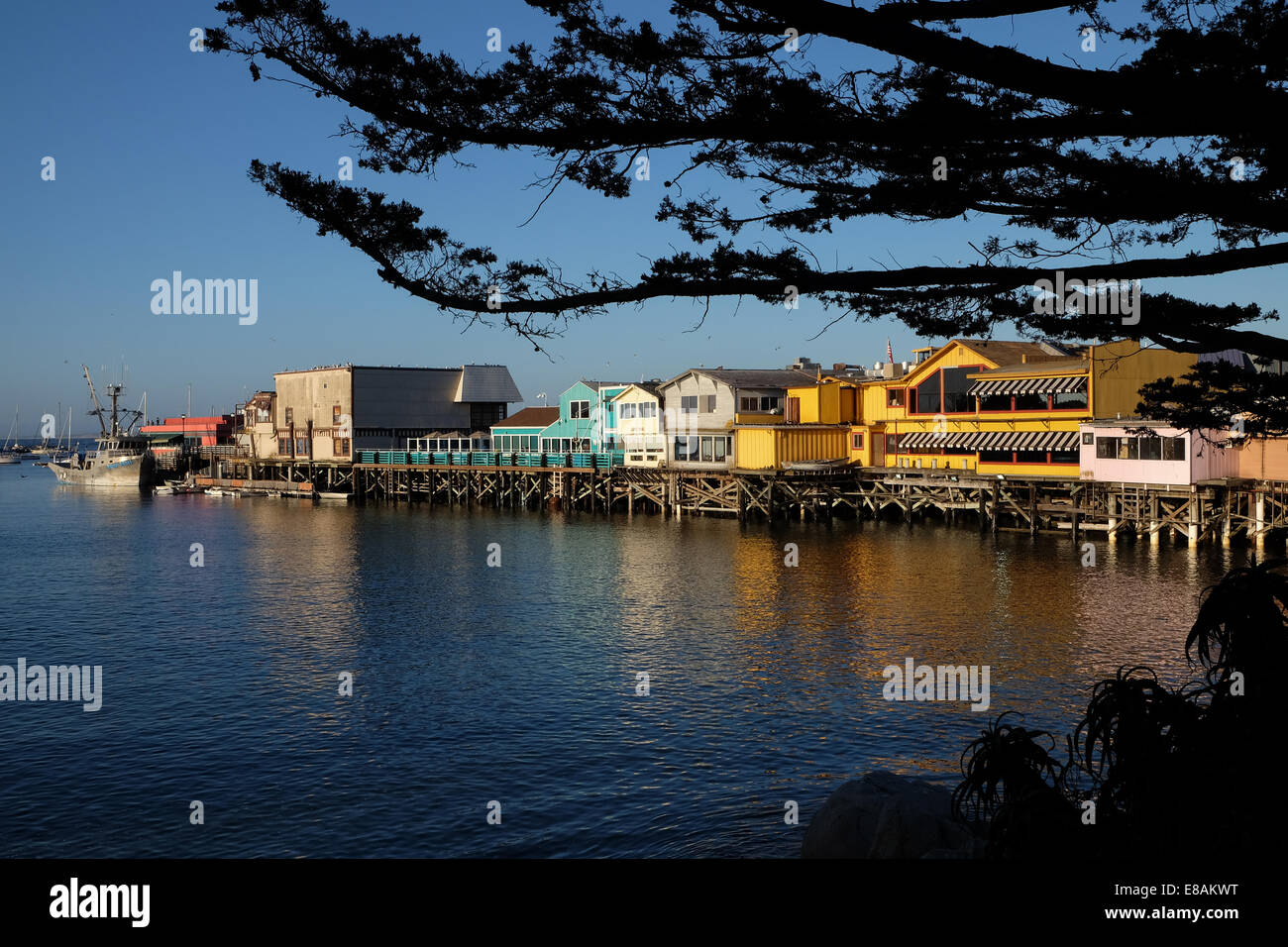 A view of Fisherman's Wharf Monterey Bay California in the setting suns golden light Stock Photo