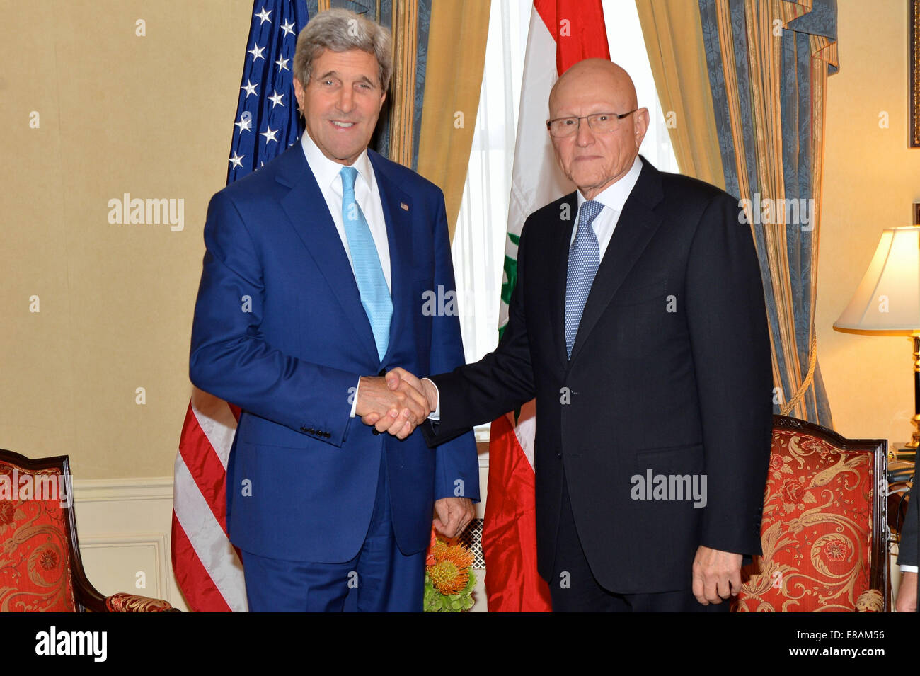 U.S. Secretary of State John Kerry greets Lebanese Prime Minister Tammam Salam before their bilateral meeting on the margins of Stock Photo