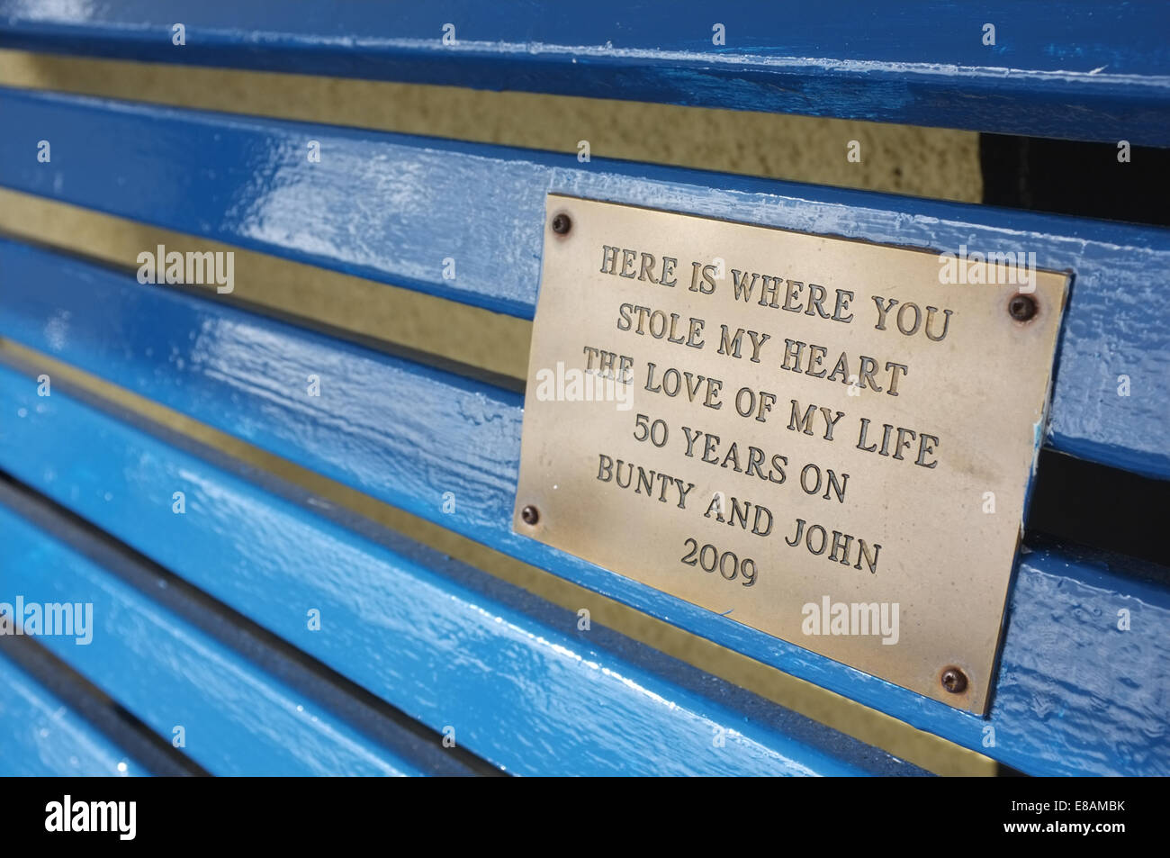 Park bench with inscription Stock Photo