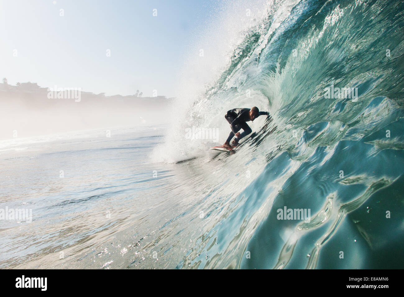 Mid adult man surfing rolling wave, Leucadia, California, USA Stock Photo