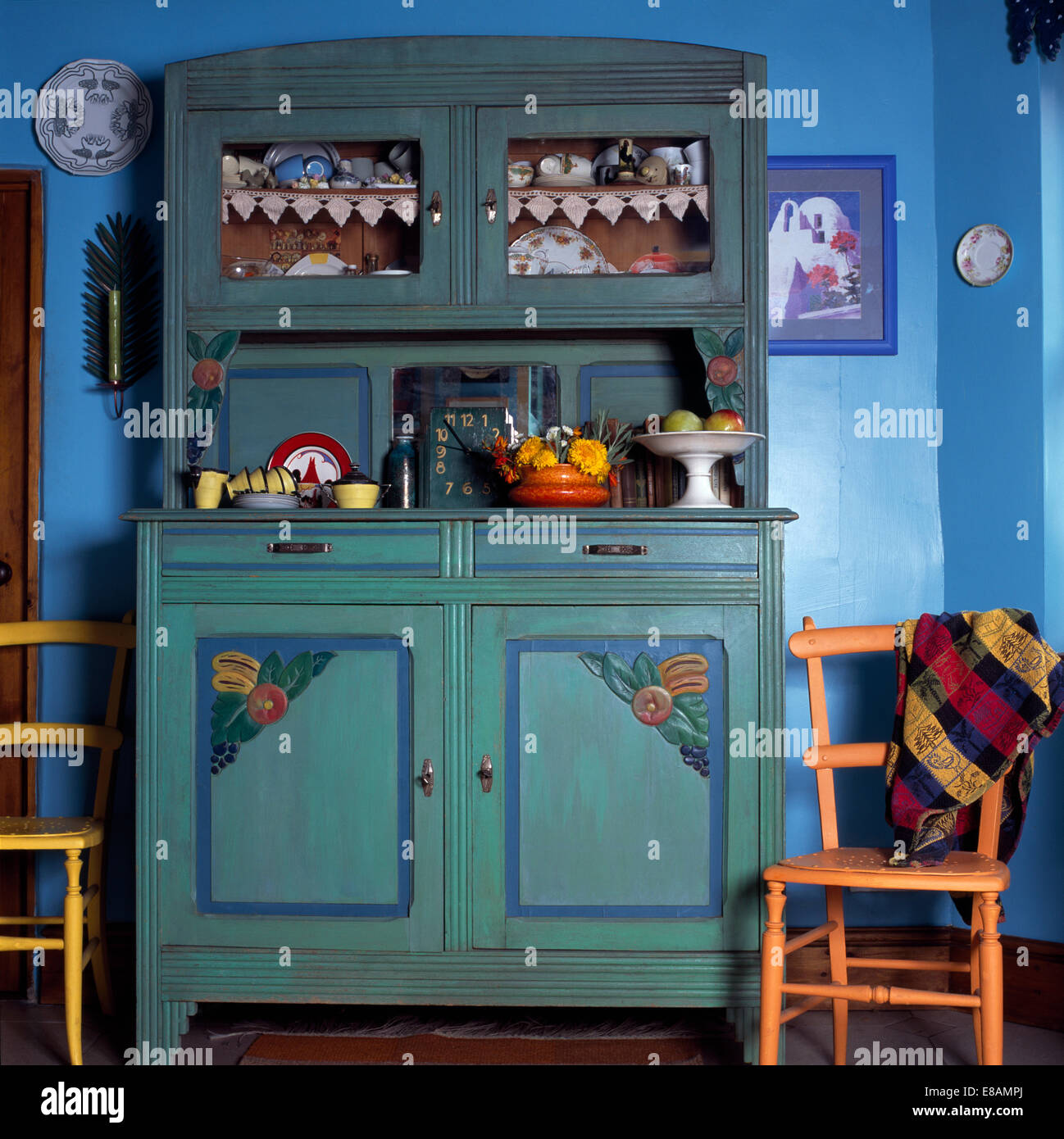 Pale Blue Painted Dresser And Painted Wooden Chairs In Blue