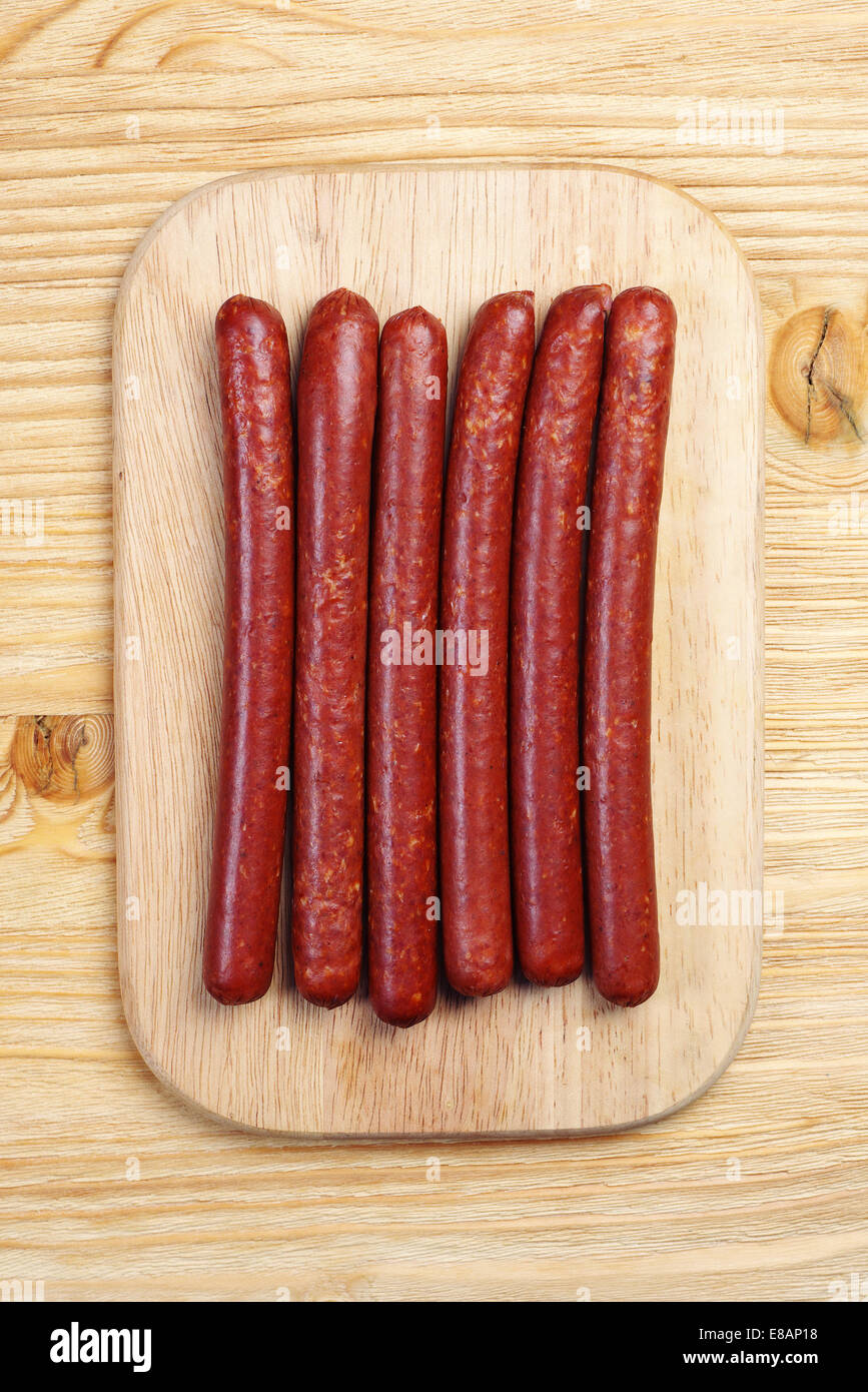 Top view on smoked sausage on a cutting board Stock Photo